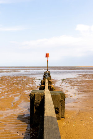 Sand Barriers Typically Seen Along Beach Locations To Prevent Large Sand Movement Occurring. The barriers prevent sand moving along with the tides or waves and building up elsewhere.の写真素材