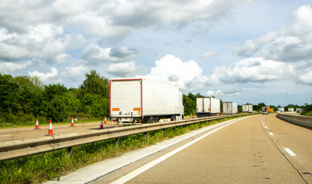 When travelling in the United Kingdom road users will often have this view of a motorway when driving to their destination.の写真素材