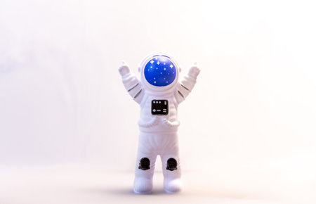 An Astronaut with their arms in the air to celebrate some type of Space expedition that has been successfulの写真素材