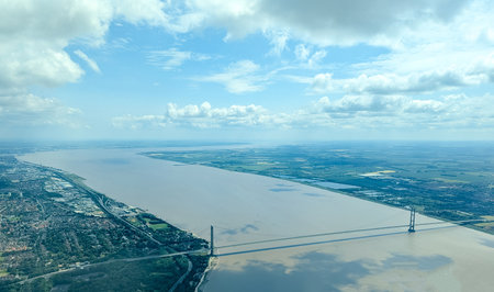 A passenger view from high above the earth's surface as an aircraft flies across the landscape.の写真素材
