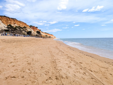 A stunning european sandy beach where holiday goers and locals go to enjoy the sand, sea and sun.の写真素材