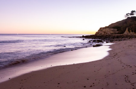 A stunning sandy beach where holiday goers and locals go to enjoy the sand, sea and sun.の写真素材