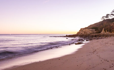 A stunning sandy beach where holiday goers and locals go to enjoy the sand, sea and sun.の写真素材