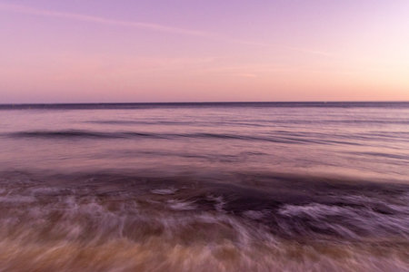 A stunning sandy beach where holiday goers and locals go to enjoy the sand, sea and sun.の写真素材