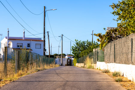 A view along a side road in a European country which lead to properties off the main routes.の写真素材