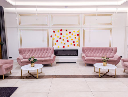 A large lobby within the entrance of a hotel, the lobby is spotless and very clean to give good first impressions to their arriving guests.の写真素材