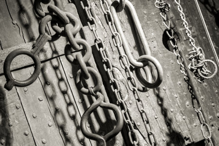Various large and heavy chains hanging from the ceiling.