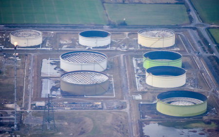A large oil refinery in the United Kingdom, seen from high above. The refinery processing oil and gas to distribute to houses and businesses around the United Kingdom.の写真素材