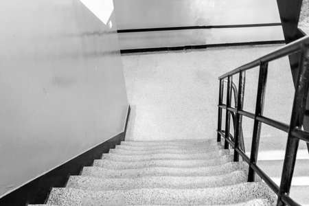 An old set of concrete stairs where people walk up and down to their levels.