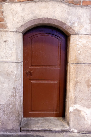 A very old door which has survived hundreds of years stands strong to this day.の写真素材
