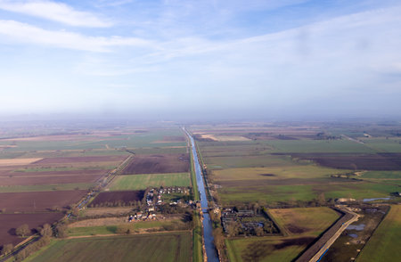 A very long and straight river that is seen from high above, the river disappearing into the...