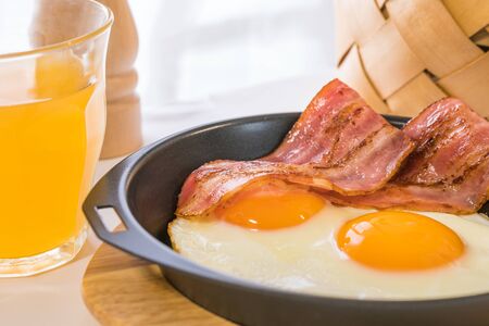 (Breakfast image) fried egg and croissantsの写真素材