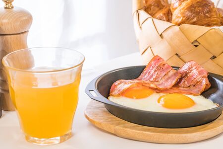 (Breakfast image) fried egg and croissantsの写真素材