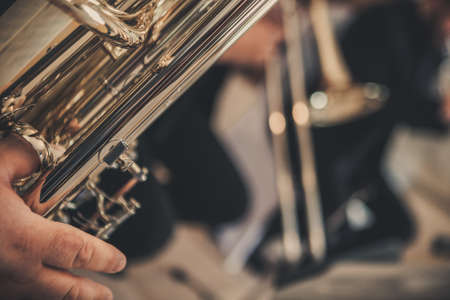 Jazz Musicians. Close-up of brass instruments. Trumpet. French Horn Close up of musicians' hands.の写真素材