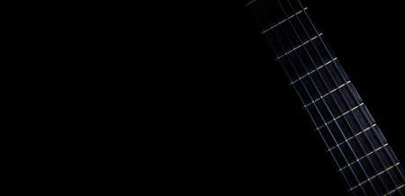 Instrument necks with visible frets. Isolated on a black background. Space for text