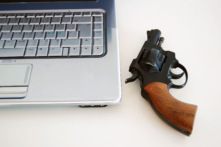revolver and computerの写真素材