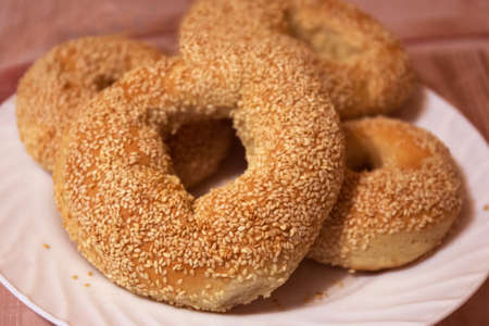 Bagels with sesame seeds, freshly baked bagels close - up view