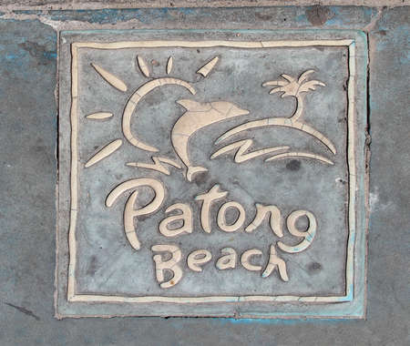 Pavement tile with a Patong Beach logo on a sidewalk of a street in Patong, Phuket, Thailandの写真素材