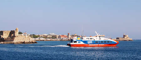 Dodekanisos Pride sea ferry of Dodecanisos Seaways ferry company in the port of Rhodes, Mandraki harbor, Rhodes, Greeceのeditorial素材