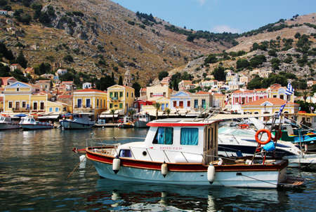 Fishing boats in the port of Symi town, Symi island, Greece