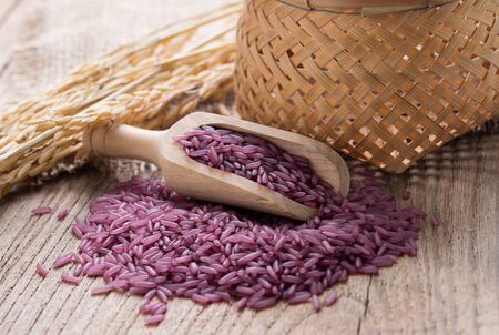 Purple rice on wooden backgroundの写真素材