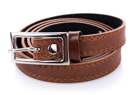 Leather belt isolated on white backgroundの写真素材