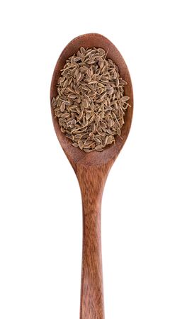 Pile of Caraway Seeds on wooden spoonの写真素材