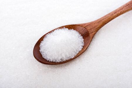 MonosodiumGlutamate (MSG or E621) on wooden spoonの写真素材
