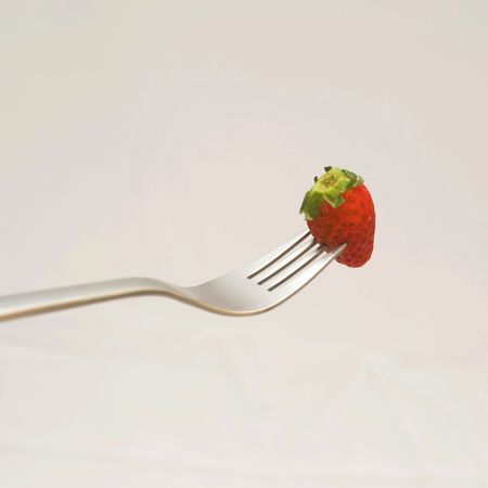 Strawberry on forkの写真素材