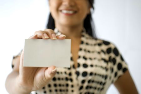 Female business woman holding greeting / business name cardの写真素材