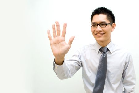 Nerdy Asian business male activating a button by palm - happyの写真素材