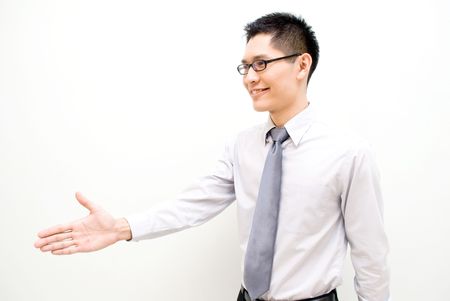 Nerdy Asian business offering handshakeの写真素材