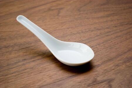 White ceramic soup spoonの写真素材