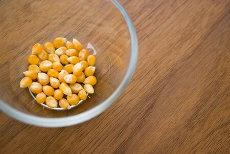 Corn kernel in glass cupの写真素材