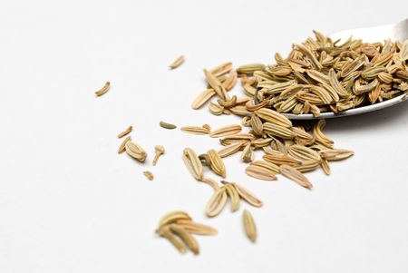Cumin seeds in metal spoonの写真素材