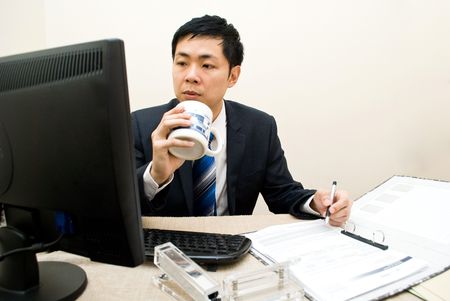 Asian businessman multi-taskingの写真素材