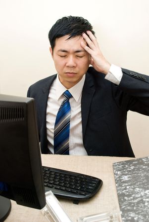 Asian businessman headacheの写真素材
