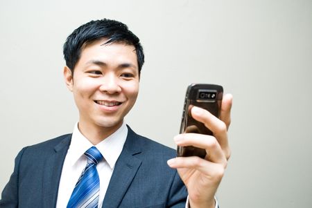 Asian business man reading sms or video callの写真素材