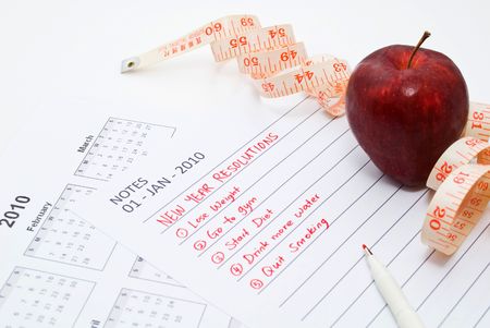 New Year Resolution diet - apple and measuring tapeの写真素材