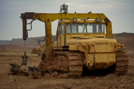 Open pit. Opencast manganese ore mine. Extractive industry. Powerful diesel-electric tractor working...