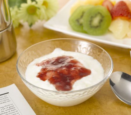 Yogurt with strawberry sauce for breakfastの写真素材