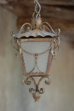 Old lamp hanging on the streetの写真素材