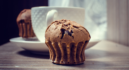 Chocolate muffin and coffee is ideal for a good breakfast.の写真素材