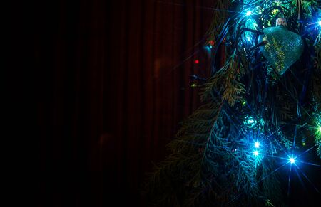Christmas lights on a tree in different colors are classic symbol of Christmas.の写真素材