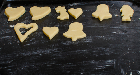 Cutting and baking Christmas cookies in Advent Time.の写真素材