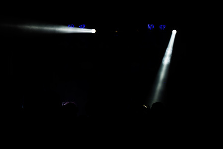 Young dancing people at the party in the shadow.