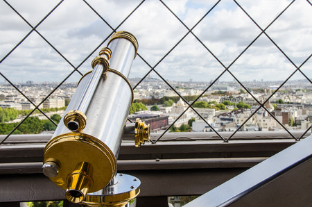 Golden telescope for observing monuments in Paris.の写真素材