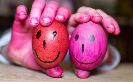 Painting easter eggs and dirty children's hands.の写真素材