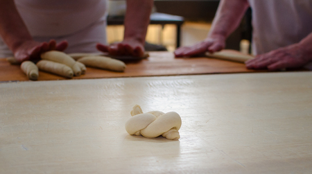 Working on a sweet pastry in a big industrial bakery.
