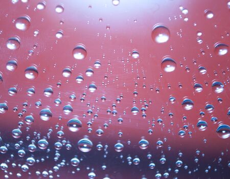 Abstraction of water droplets on a blue background
